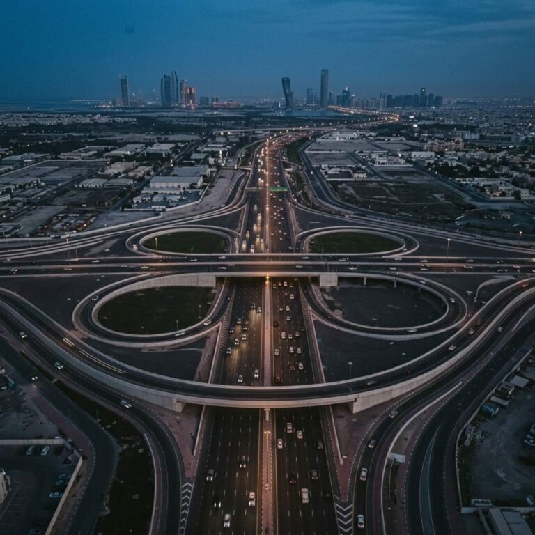 Abu Dhabi highway interchange with business vehicles at blue hour